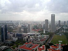 An aerial view of Singapore, showing the Padang on the right, surrounded by Parliament House building, new and old Supreme Court Buildings and Swissotel The Stamford. Aerial view of the Downtown Core, Singapore - 20050326-03.jpg