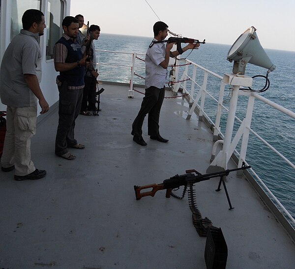 Armed contractors aboard a merchant ship to deter piracy.