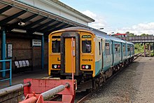 An Arriva Trains Wales Class 150 waits at the station, before returning to Bidston.