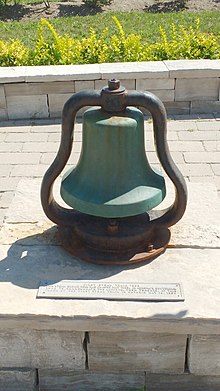 Commemorative locomotive bell at the station. Aurora station first train bell (29354189262).jpg