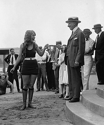 Woman receiving an award for winning a beauty pageant, 1922