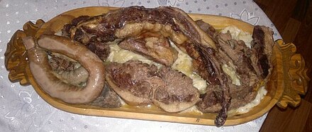 Festive beshbarmak served with kazy sausage