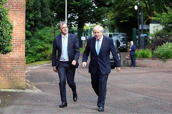 Smith (left) and Prime Minister Johnson (right) visit Northern Ireland in July 2019