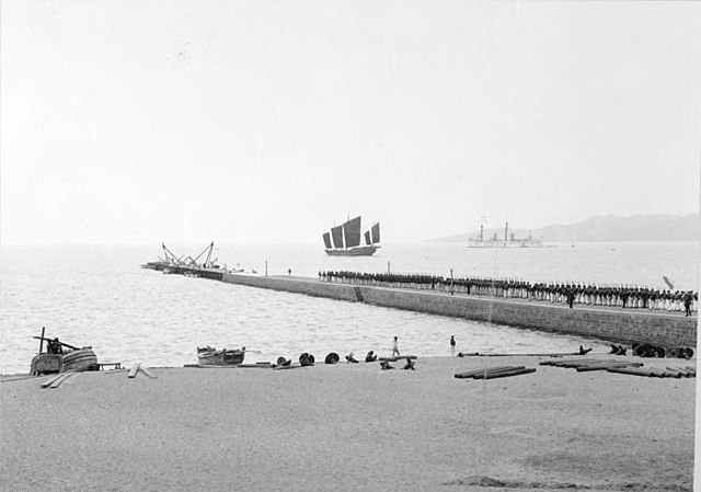 Pier with German naval personnel, apparent expansion in progress, 1898
