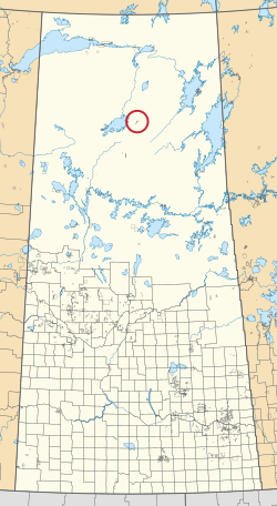 Саскачеван провинциясының картасы, 297 ауылдық муниципалитеттер мен жүздеген шағын үнді қорықтарын көрсетеді. Біреуі қызыл шеңбермен ерекшеленеді.