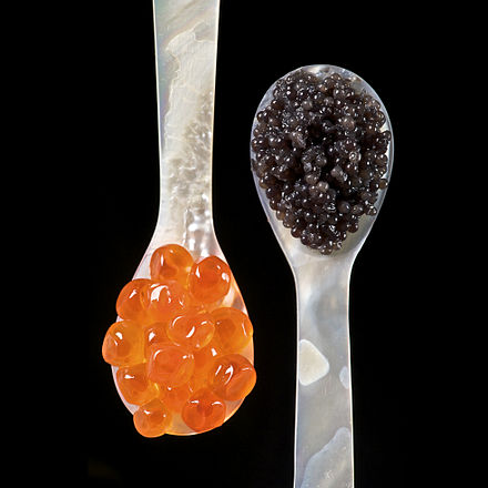 Salmon roe (left) and sturgeon caviar (right) served with mother of pearl caviar spoons to avoid tainting the taste of the caviar.