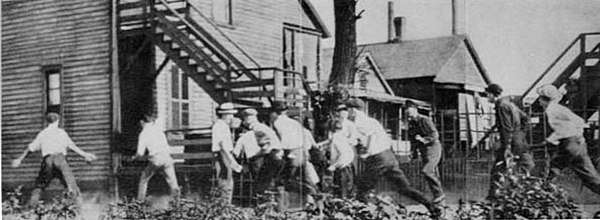 A white gang looking for African Americans during the Chicago Race Riot of 1919. This and a subsequent picture at The Crisis Magazine 1919 Vol 18 No. 