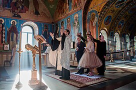 The photograph showcases an authentic Russian wedding ceremony.