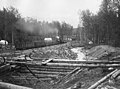 Coal train at Eska Creek coal mine, passing tents at side of rail line, Alaska, between 1912 and 1922 (AL+CA 5383).jpg