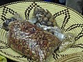 Dried fruits Jackal berries and Berchemia discolor from Northen Namibia displayed in the Oshiwambo palm basket