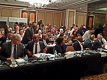 Eskom executives including Phakamani Hadebe (CEO), front row second from the left, and Jan Oberholzer (CTO), front row far left, at a 2019 public forum in Cape Town on Eskom's financial situation. Eskom board at cape town.jpg