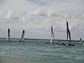 Extreme 40 class sailing catamarans, seen racing off Egypt Point, Cowes, Isle of Wight during Cowes Week in 2011. Cowes was a stage on the Extreme 40 races for 2011. Races were run off Egypt Point (by the Extreme 40 tent), and were separate from the standard Cowes Week races (that start from the Royal Yacht Squadron).