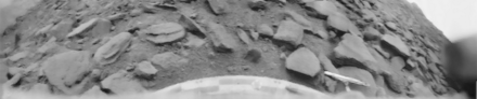 First view and first clear 180-degree panorama of Venus's surface as well as any other planet than Earth (1975, Soviet Venera 9 lander). Black-and-white image of barren, black, slate-like rocks against a flat sky. The ground and the probe are the focus. Foto de Venera 9.png