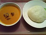 Fufu (right) is a staple food of West and Central Africa. It's a thick paste made by boiling starchy root vegetables in water and pounding the mixture with a mortar and pestle. Peanut soup is pictured left.