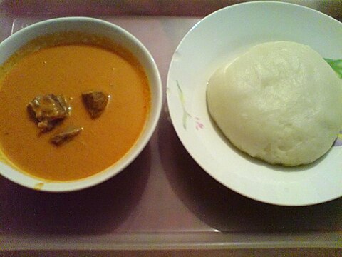 A plate of fufu (right) accompanied with peanut soup Fufu.jpg