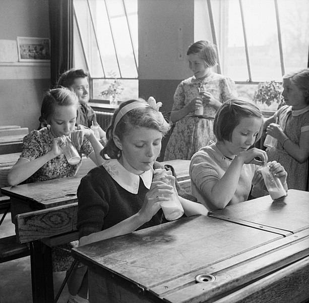 File:Girls at Baldock County Council School in Hertfordshire enjoy a drink of milk during a break in the school day in 1944. D20552.jpg