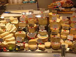 These cheeses are private goods. They are rivalrous, as the same piece of cheese can only be consumed once. They are also excludable, as it is possible for the store to prevent someone, such as a non-customer who will not pay the price, from consuming the cheese, as it is privately owned. Grocery store in Roma.jpg