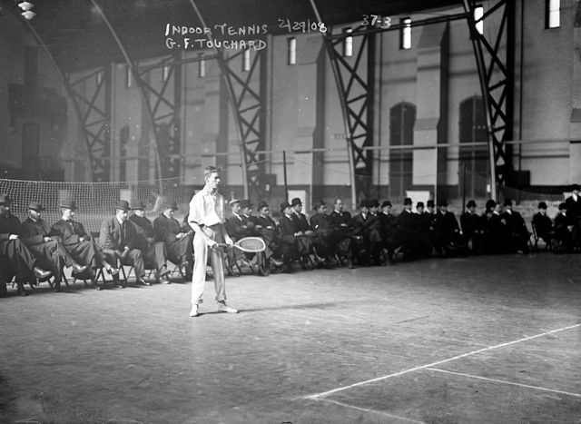 Gustave F. Touchard at the 1908 U.S. National Indoor Tennis Championships played in the Seventh Regiment Armory in New York
