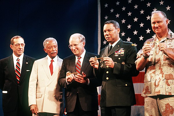 Dinkins (second from the left) with New York governor Mario Cuomo, Secretary of Defense Dick Cheney; Chairman Joint Chiefs of Staff Colin Powell, and 