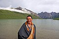 Local Tibetan standing in front of Lake Ximencuo on the Tibetan Plateau
