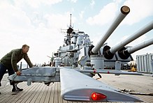 A technician moves a Pioneer RPV across the fantail of Wisconsin. Pioneer RPV on USS Wisconsin (BB-64).jpg