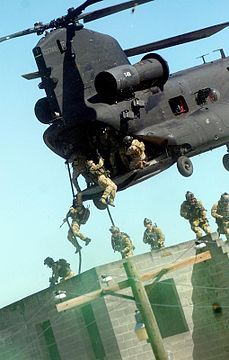 Rangers practice fast roping techniques from an MH-47 during an exercise at Fort Bragg, 28 April 2010