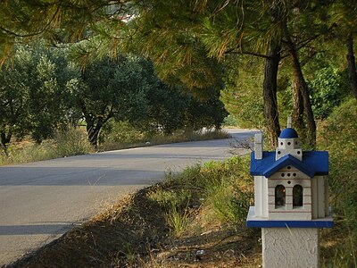 Road with small church near Dikella