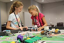 A Mindstorms EV3 robot is used to navigate a First Lego League (FLL) course as part of a summer camp. Robotics Camp 2018 (41276792080).jpg