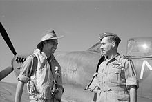 Squadron Leader Robert Hayes, Commanding Officer of No. 273 Squadron chats with Air Marshal Sir Guy Garrod, the Allied Air Commander in Chief, Air Command South East Asia, by a Spitfire Mark VIII at Cox's Bazar, 1944