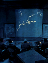 SAGE system for nuclear war--MITRE's first command and control project SAGE control room.png