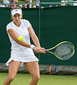 Stephanie Vogt competing in the first round of the 2015 Wimbledon Qualifying Tournament at the Bank of England Sports Grounds in Roehampton, England. The winners of three rounds of competition qualify for the main draw of Wimbledon the following week.