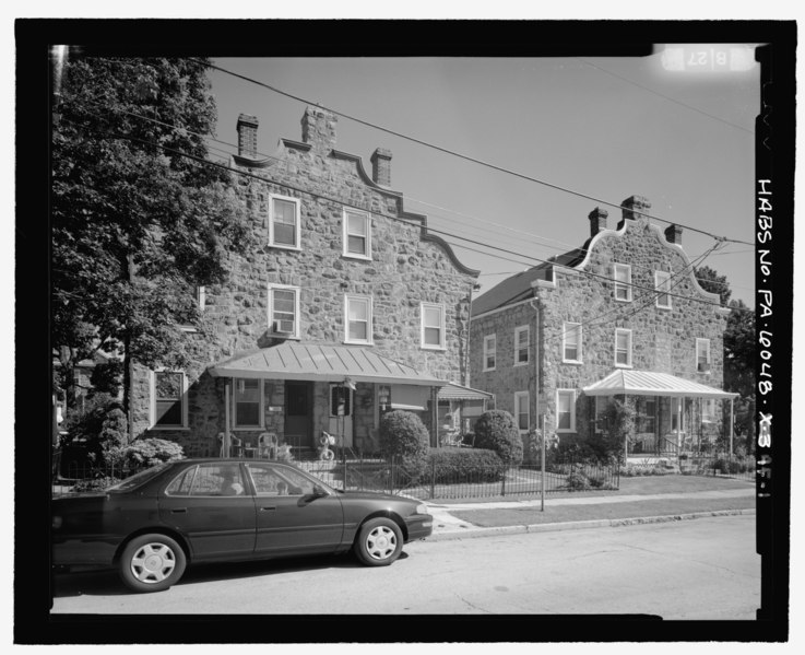 File:Streetscape view, looking from the north to highlight the three-story, three chimney houses - Keasbey and Mattison Company, Three-story, three chimney gable front double house type, HABS PA-6048-AF-1.tif