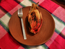 A tamal dulce breakfast tamal from Oaxaca, Mexico. It contains pineapple, raisins and blackberries. Tamal de zarzamoras.png