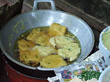 Deep frying mendoan tempeh, Indonesian food is often prepared by deep frying which adds saturated fat and cholesterol. Tempe mendoan fried tempeh.jpg