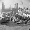 Wounded being transferred from Austin K2/Y ambulances to a hospital ship at the Mulberry artificial harbour, September 1944.