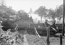 Universal Carriers and DUKWs carry the men of 5th Bn, Duke of Cornwall's Light Infantry, into battle during Operation Market Garden, 18 September 1944. The British Army in North-west Europe 1944-45 BU935.jpg