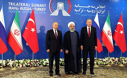 Putin with Iranian president Hassan Rouhani and Turkish president Recep Tayyip Erdoğan, September 2018