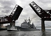 Lake Erie under tow passing under a drawbridge on the Willamette River en route to Portland, Oregon Lake Erie Drawbridge.JPG