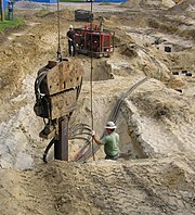 A diesel-powered vibratory pile driver on a steel I-beam Vibratorypiledriver05.JPG