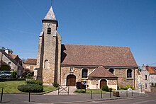 photographie dune église ; vue latérale de la nef et du clocher en meulière.