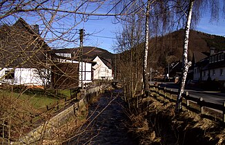 The Elsoff in Alertshausen with an old stone arch bridge