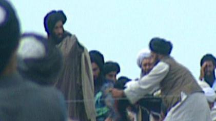 File:Mullah Omar reveals the Prophet's cloak.jpg