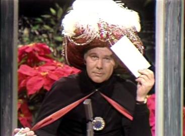 Carson as Carnac the Magnificent, a reoccurring comedic role he introduced in 1964.