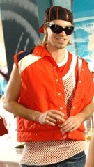 Darren's earlier appearance including his "customary string vests and bling" (2009). Darren osborne appearance.jpg