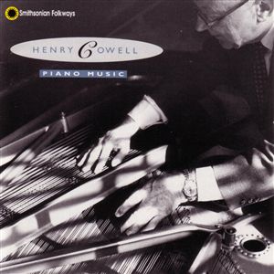 File:Henry Cowell playing string piano.jpg