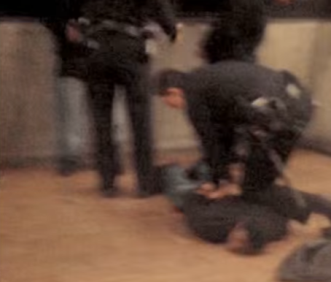 File:Police handcuffing Oscar Grant.png