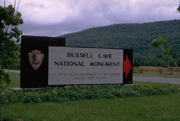 Entrance to Russell Cave National Monument with old entrance sign