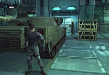 Solid Snake hiding from a guard, behind an M1 Abrams main battle tank. When Snake leans on a corner, the camera shifts to his front for dramatic effect and to enable sight down corridors.