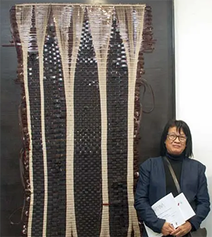 File:Madame Zo with her work.png