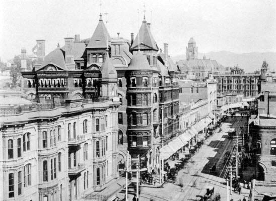 Looking north on Spring Street, 1900. The Hollenbeck Hotel is on the southwest corner of Spring and Second streets. The Bryson-Bonebrake Block is on the northwest corner. The County Courthouse is in the background.